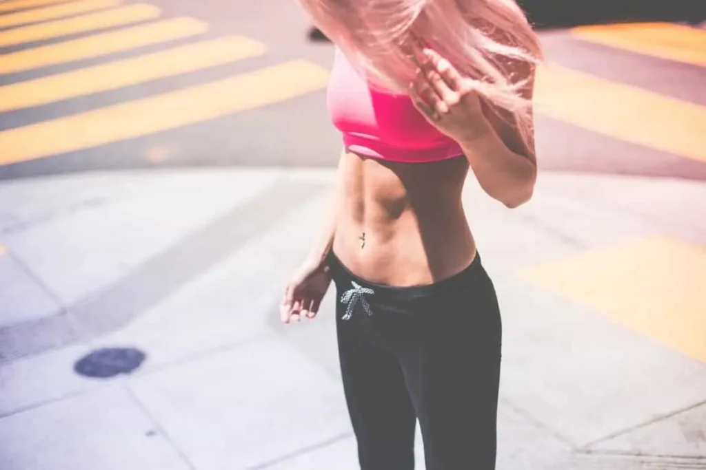 Woman with toned stomach after LA-EMS Body Sculpting Treatment Clifton