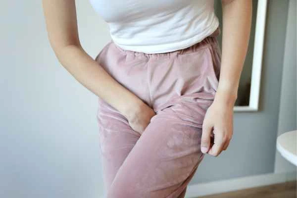woman running for the toilet because of urinary incontinence Clifton